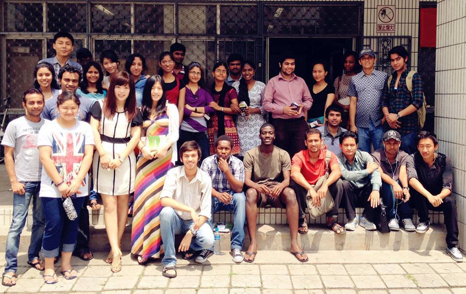 Staff welcoming students at Chinese university campus